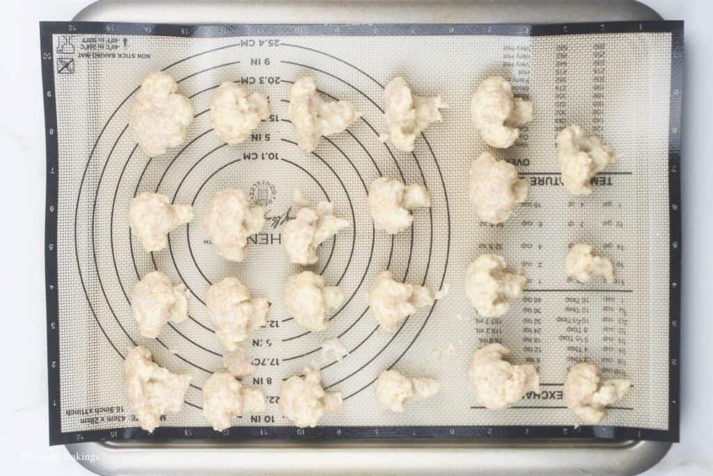 florets transferred to a baking sheet, image created by SimplyBakings