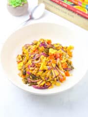 Sautéed Pickled Mustard Greens with Eggs in a white serving plate