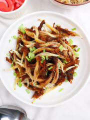 filipino fired dilis garnished with spring onions