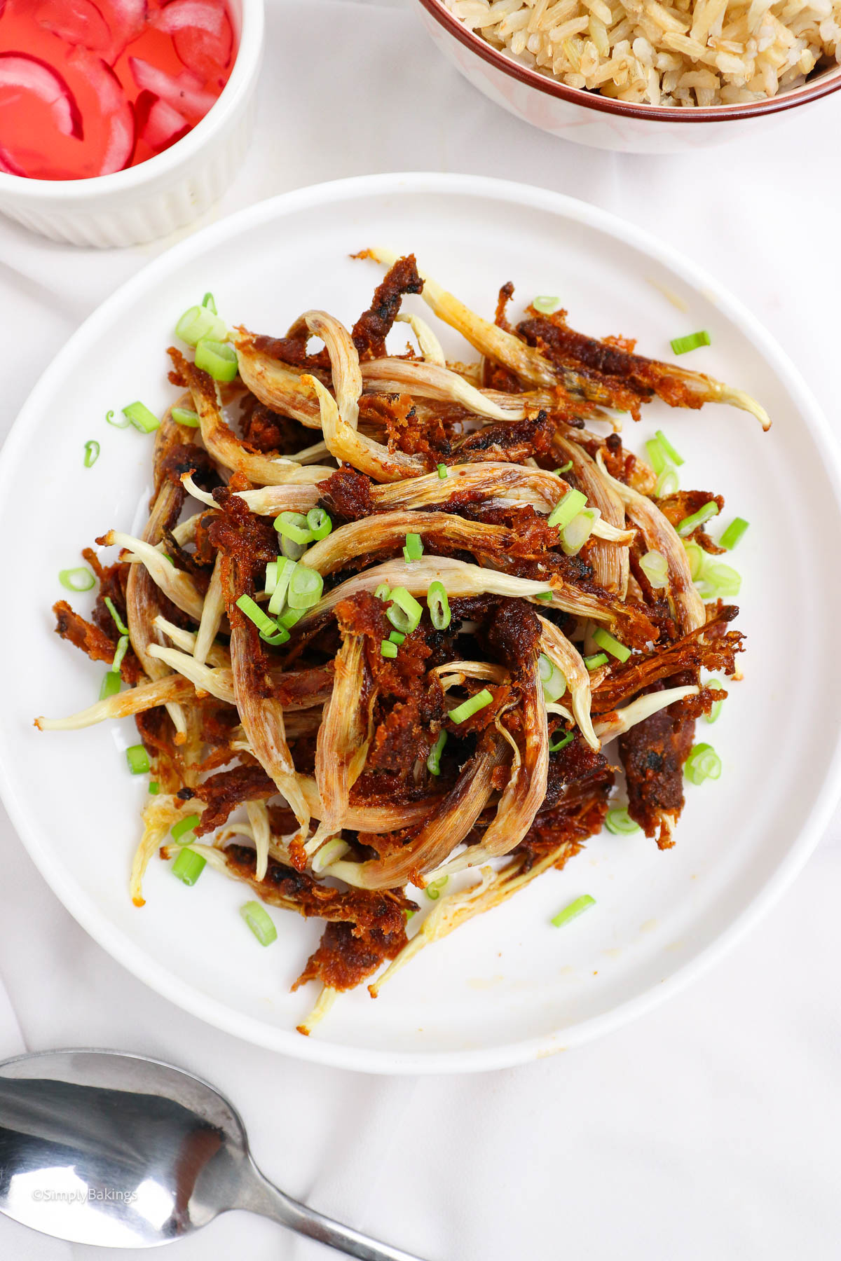 filipino fired dilis garnished with spring onions
