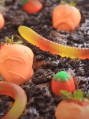 yummy dirt pudding with gummy worms and strawberries