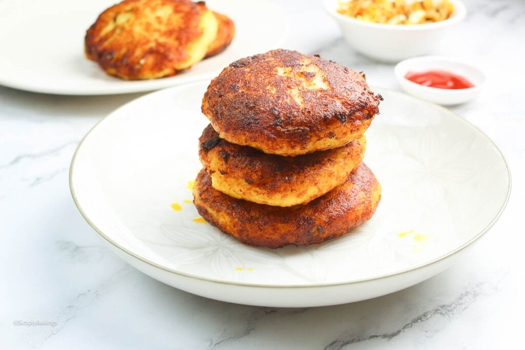 delicious stuffed Filipino potato cakes served on a white plate