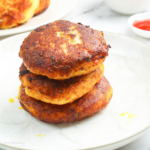a stack of deliciously Stuffed Filipino Potato Cakes on a white plate