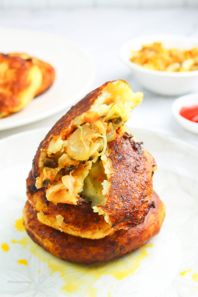 half-opened potato cake on a white plate