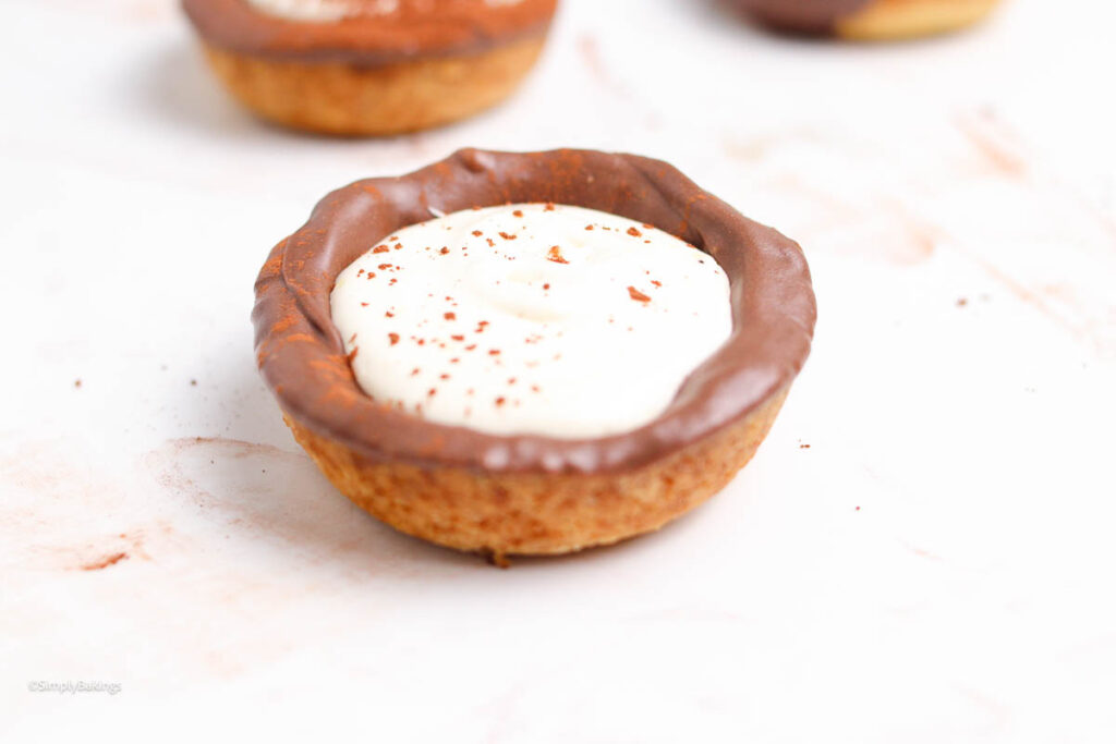 delicious tiramisu tartlets with cocoa powder dusting