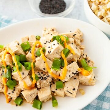 tasty tofu poke bowl with sriracha mayo servec on a plate