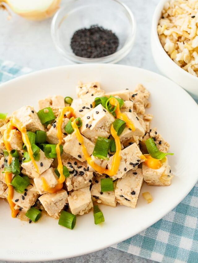 tasty tofu poke bowl with sriracha mayo servec on a plate