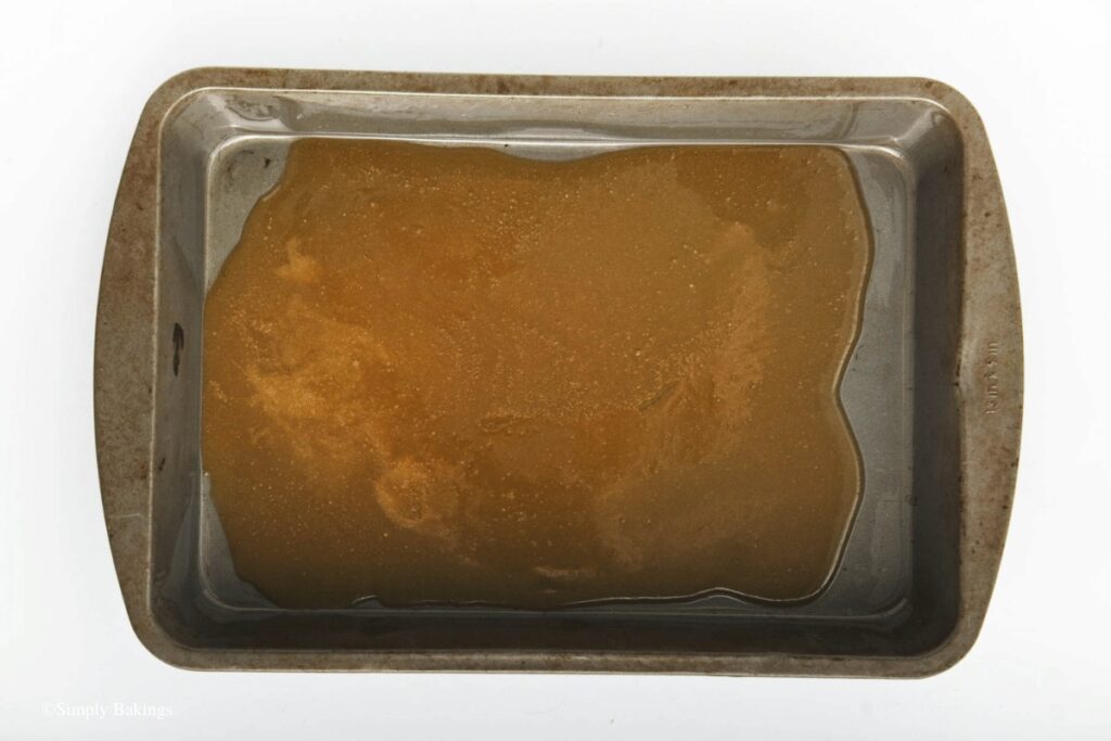 sugar glaze poured to baking pan base