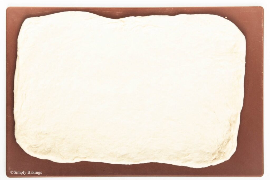 risen dough rolled into a rectangle