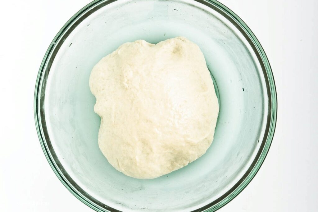 rested dough in oiled bowl