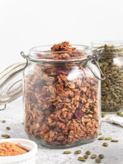 healthy pumpkin spice granola stored in a mason jar