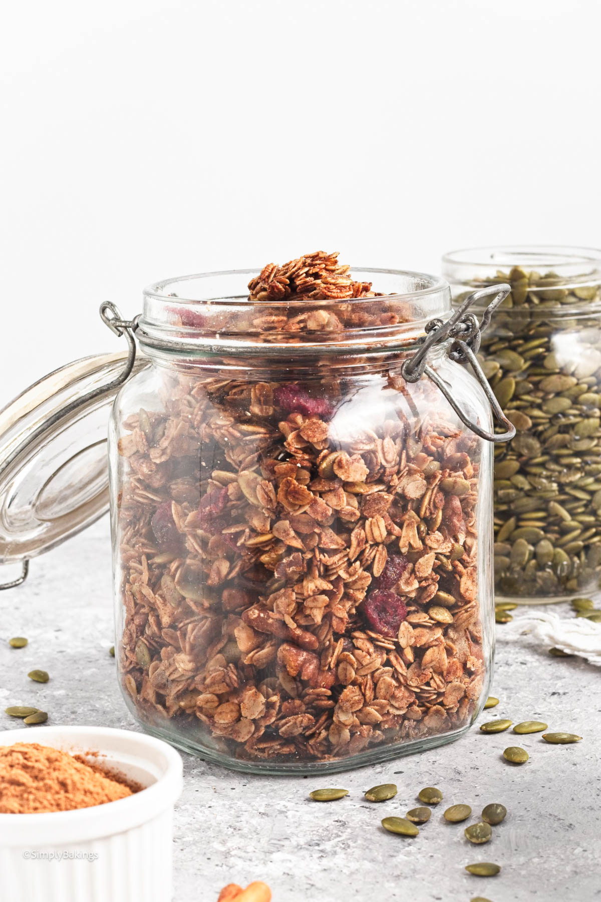 healthy pumpkin spice granola stored in a mason jar