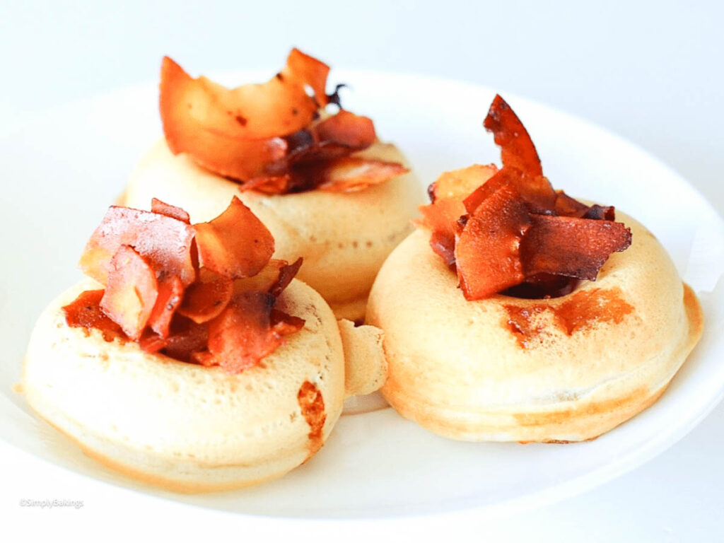 3 vegan maple bacon pancake bites on a white plate