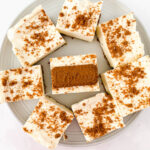 slices of Biscoff Cheesecake Bars arranged in a round plate