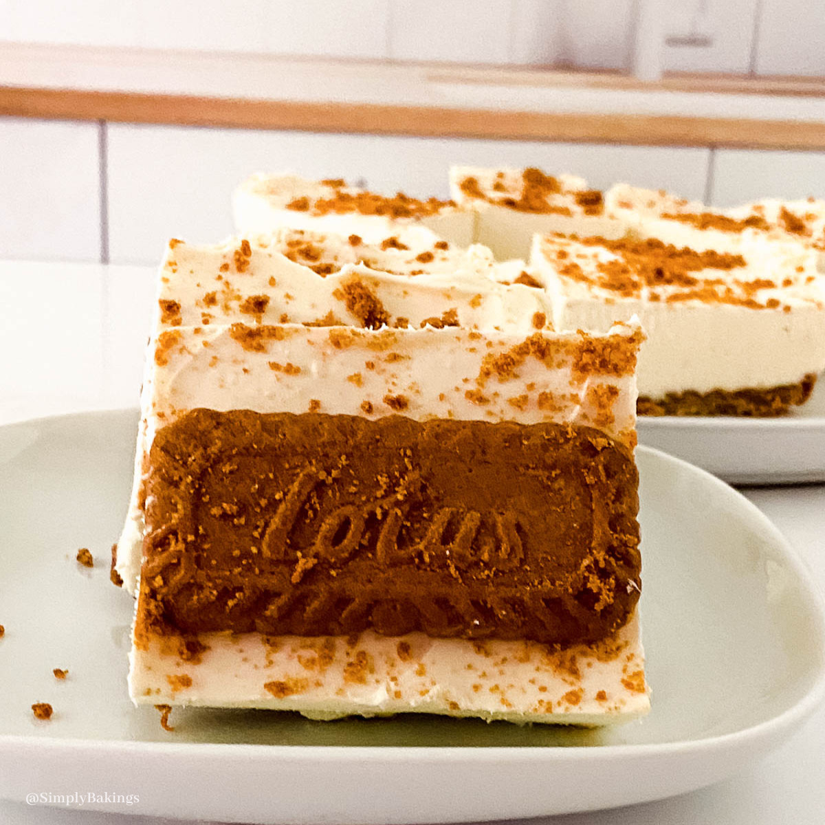 Biscoff Cheesecake Bars slice on a plate
