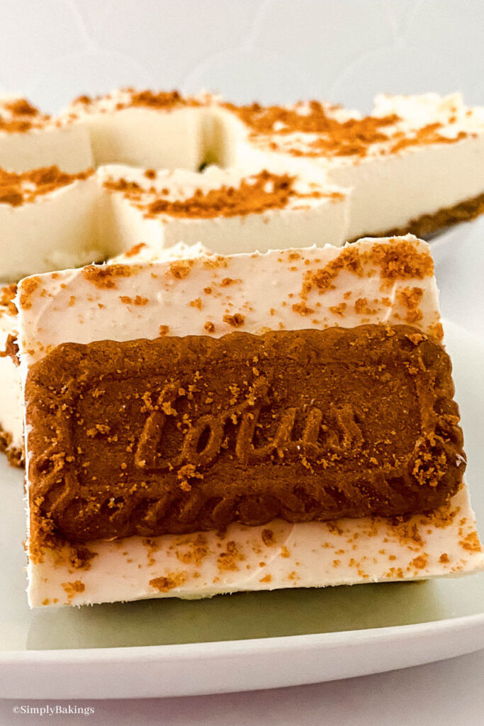 slices of lotus biscoff cheesecake bars on a plate