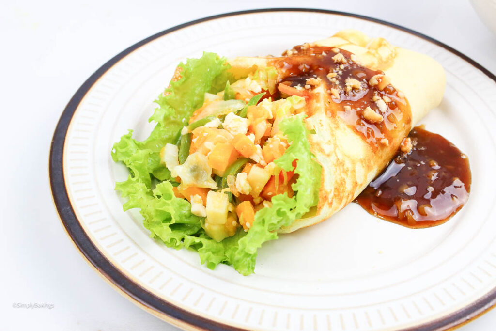 delicious lunpiang sariwa with peanut sauce on top