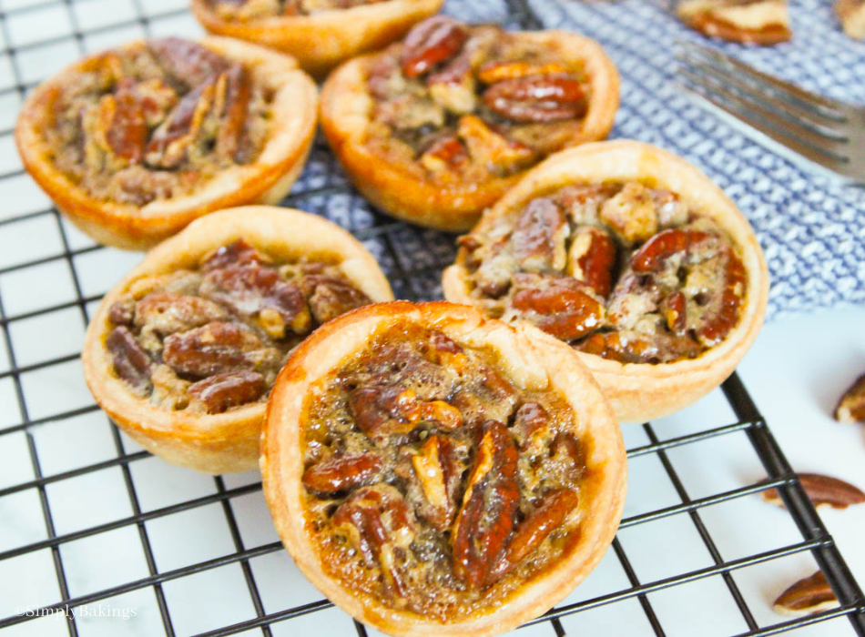 delicious mini pecan pies placed on a cooling rack