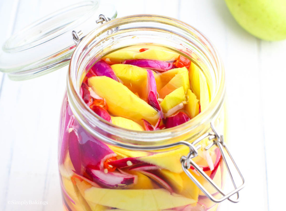 an opened jar of pickled mangoes 