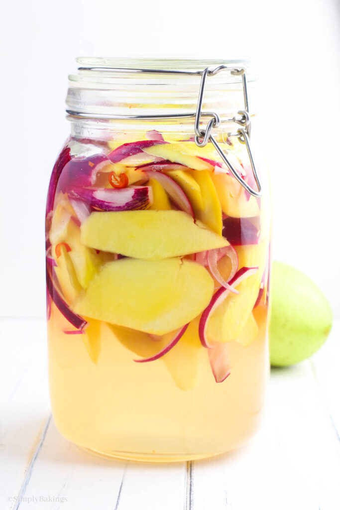 pickled mangoes (burong mangga) in a jar with lid
