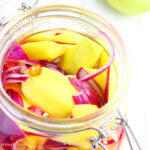 an open jar of pickles mangoes (burong mangga)