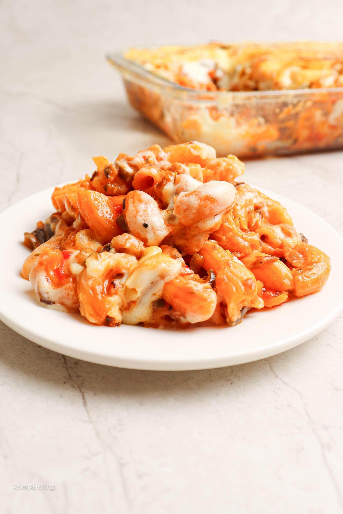 Baked macaroni coated in cheese and sauce