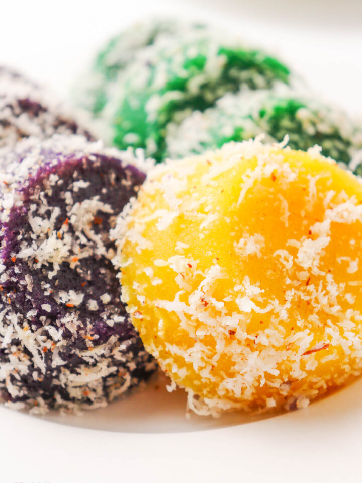 A plate of colorful Pichi Pichi sprinkled with grated coconut