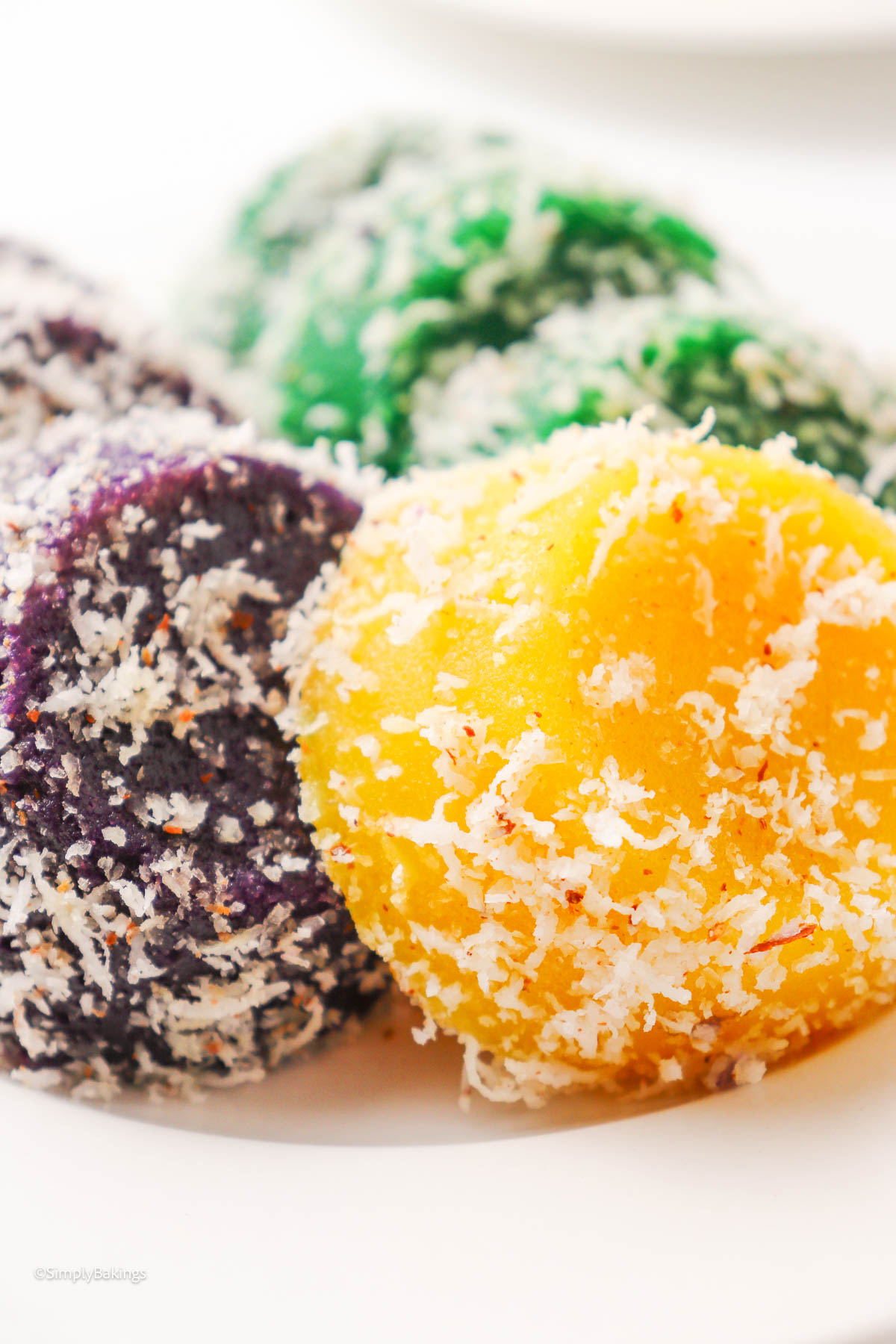A plate of colorful Pichi Pichi sprinkled with grated coconut