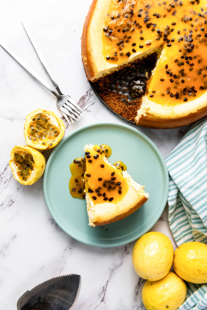 Passion fruits surrounding a plate of delicious cake