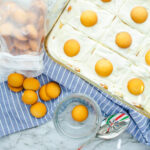 Banana pudding on a marble table with cookies