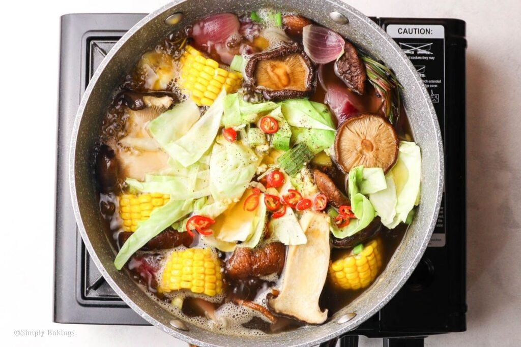All ingredients mixed into a pot of soup