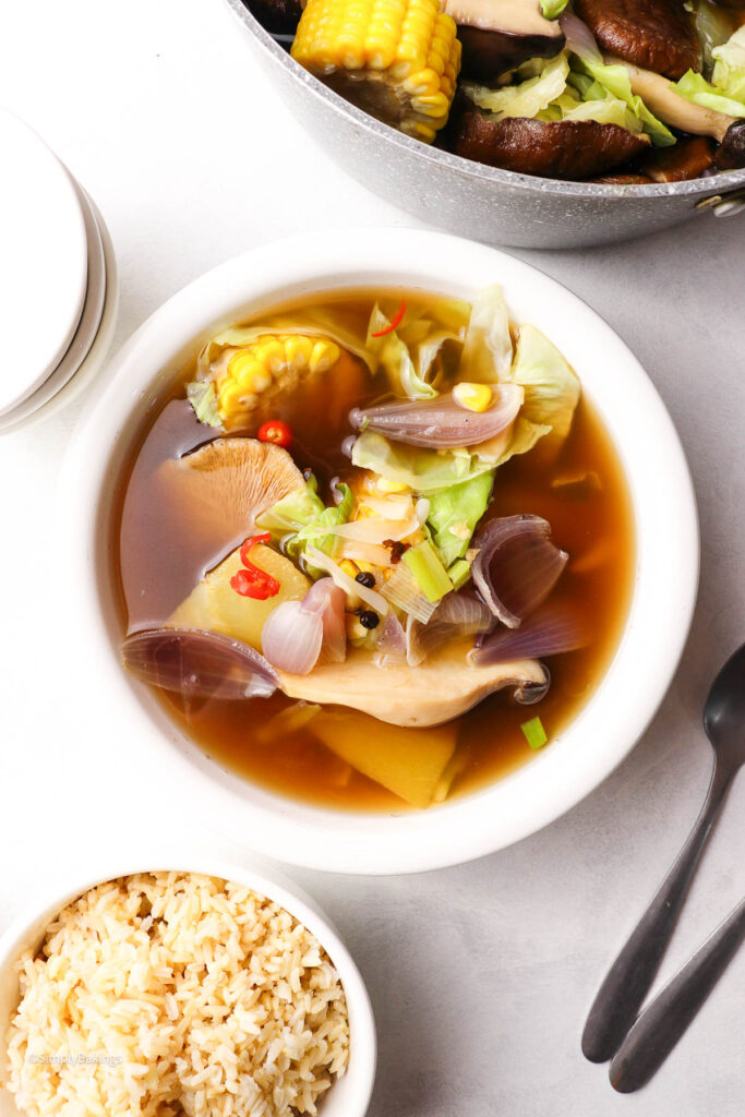 Bowl of soup with sweet corn, cabbage, and a rich, flavorful broth