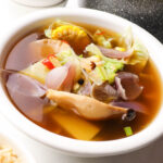 White bowl filled with delicious Vegan Bulalo soup