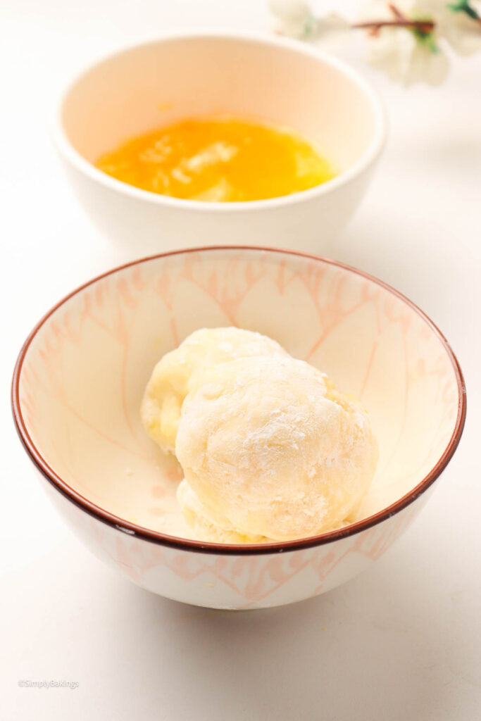 A bowl of Mango Mochi next to Mango jam
