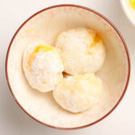 A white bowl of three Mango Mochis