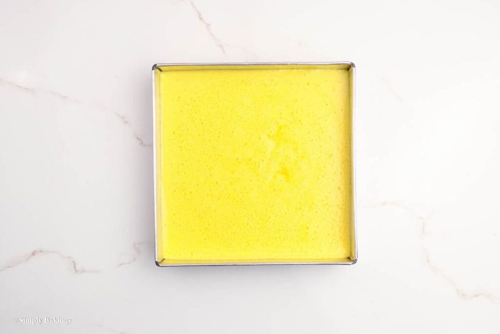 Mixture cooling down in square cake pan