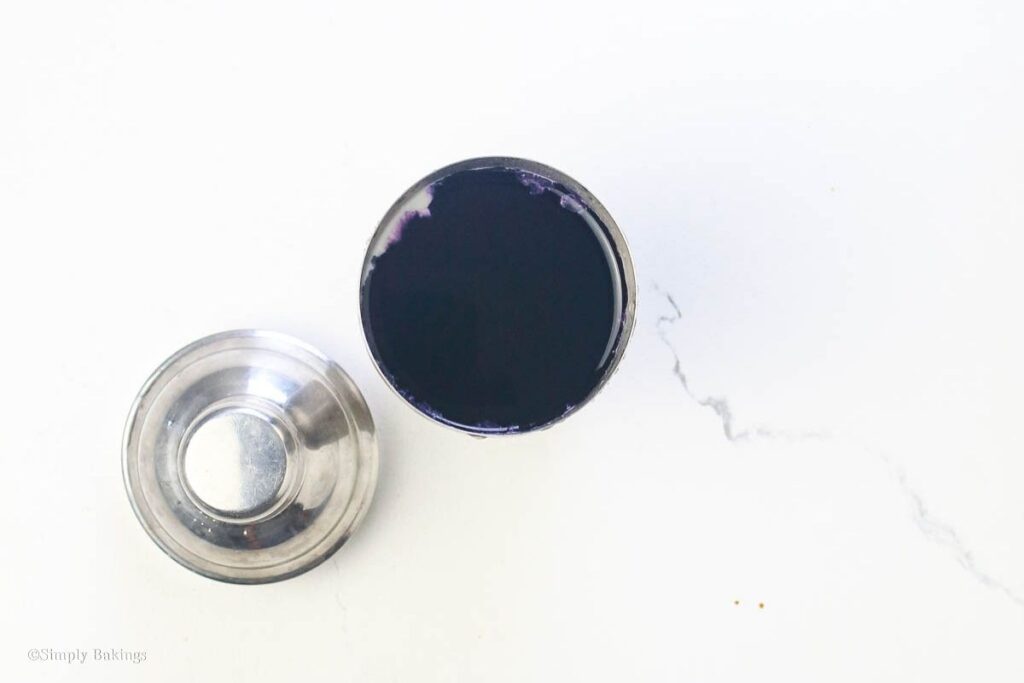 Deep ube extract in a small steel cup