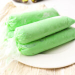 avocado ice candy on a white plate