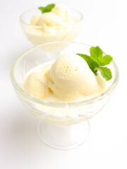 delicious durian ice cream servings in a clear glass garnished with peppermint leaves
