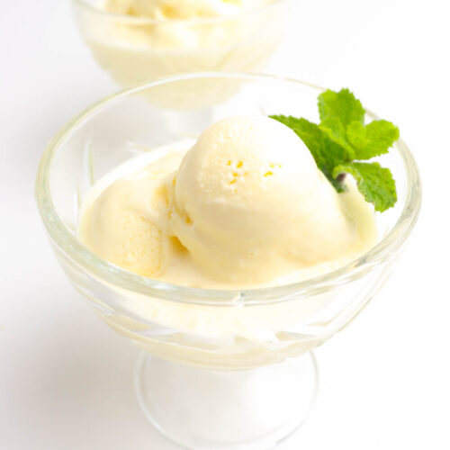 delicious durian ice cream servings in a clear glass garnished with peppermint leaves