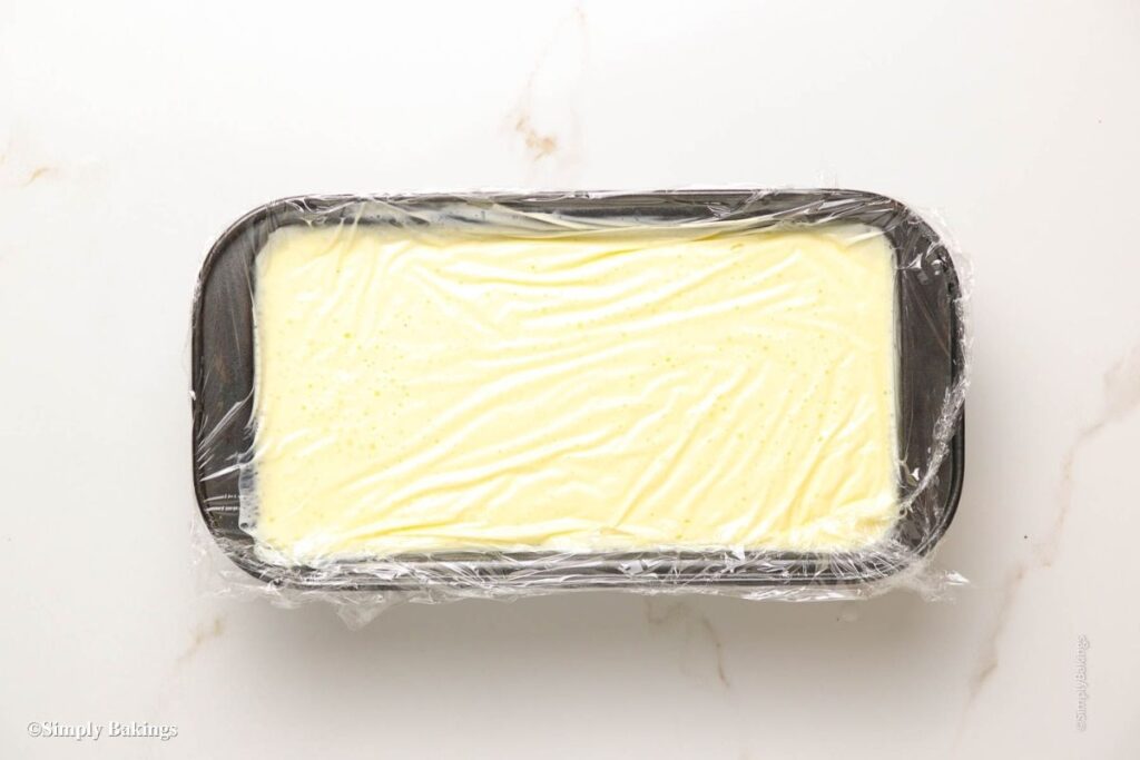 durian ice cream in a container wrapped with cling film