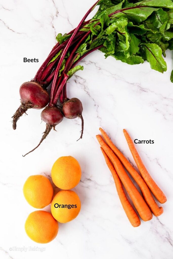 All ingredients of red juice recipe on a white marble space