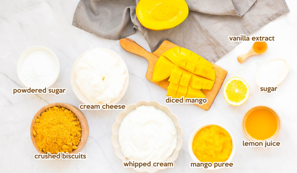 All ingredients of mango cheesecake recipe in separate bowls