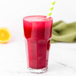 A tall glass of healthy and refreshing red juice