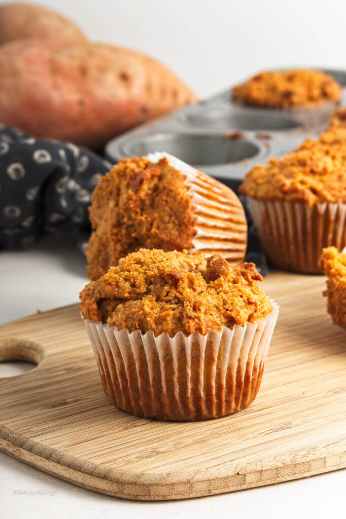 A few muffins on a wooden board