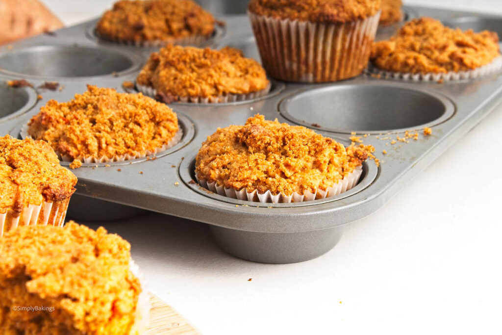 Baking tray with muffins in and out