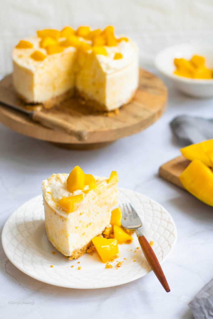 A slice of Mango Cheesecake with fork
