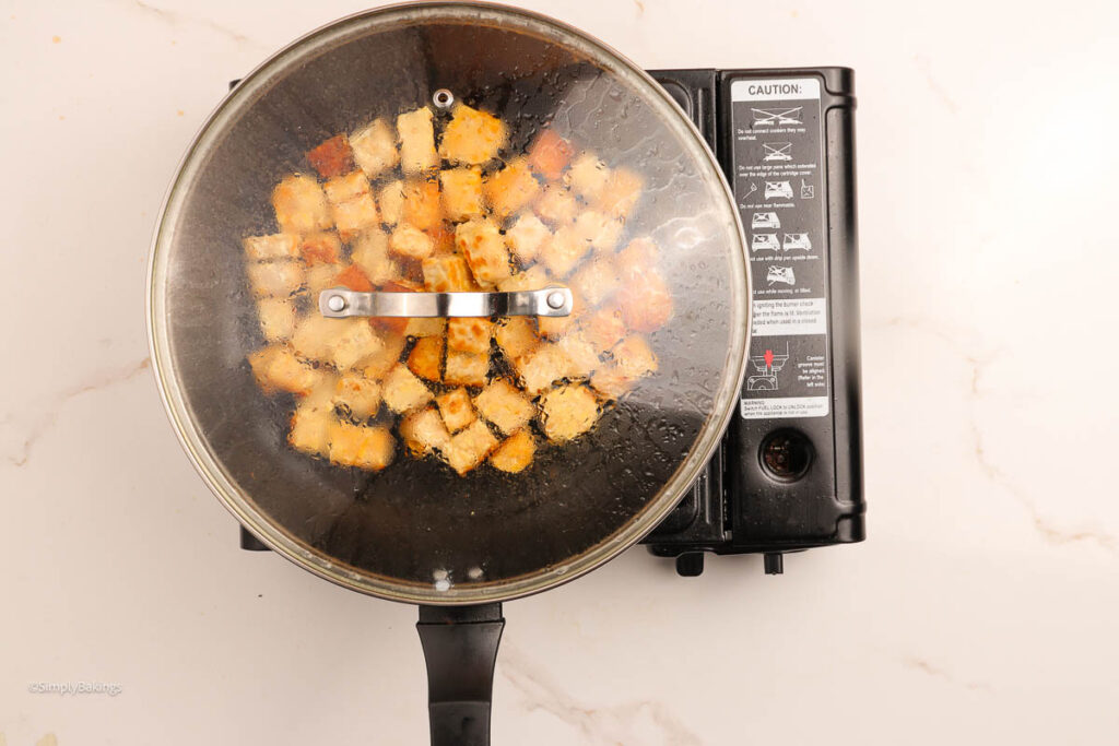 Tempeh cubed and cooked in pan