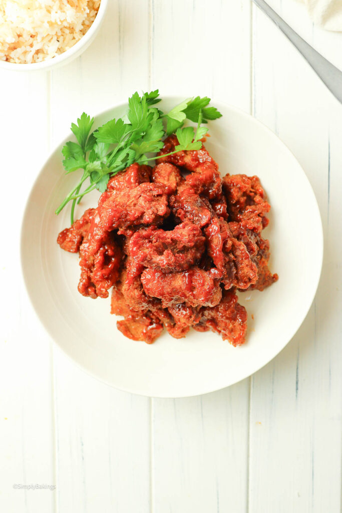 A plate of Vegan Filipino BBQ garnished with garnished with cilantro leaves