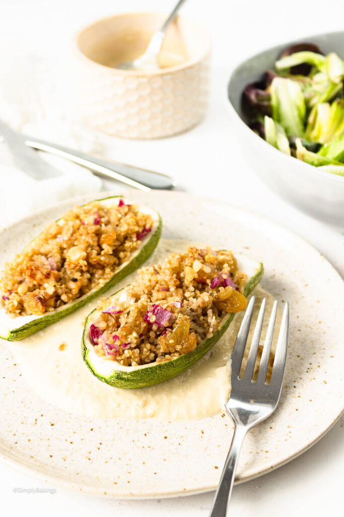 Vegan Stuffed Zucchinis beside a stainless steel fork on a plate